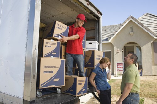 Household boxes and furniture prepared for removals and storage in a central London property