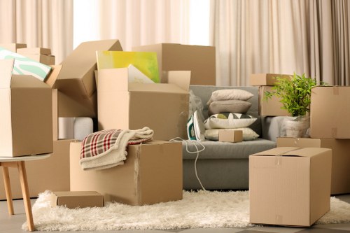 Careful wrapping of fragile household items during a Soho packing service